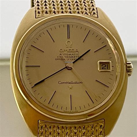 omega constellation yellow gold watch.